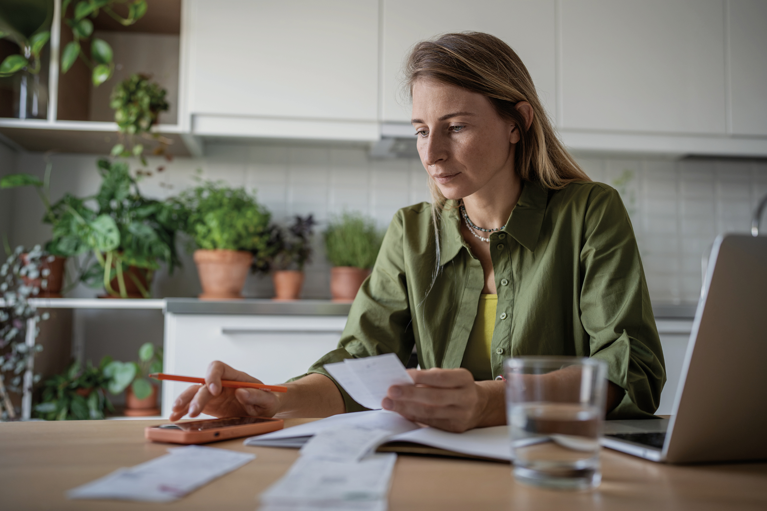 Woman reading paperwork at a table